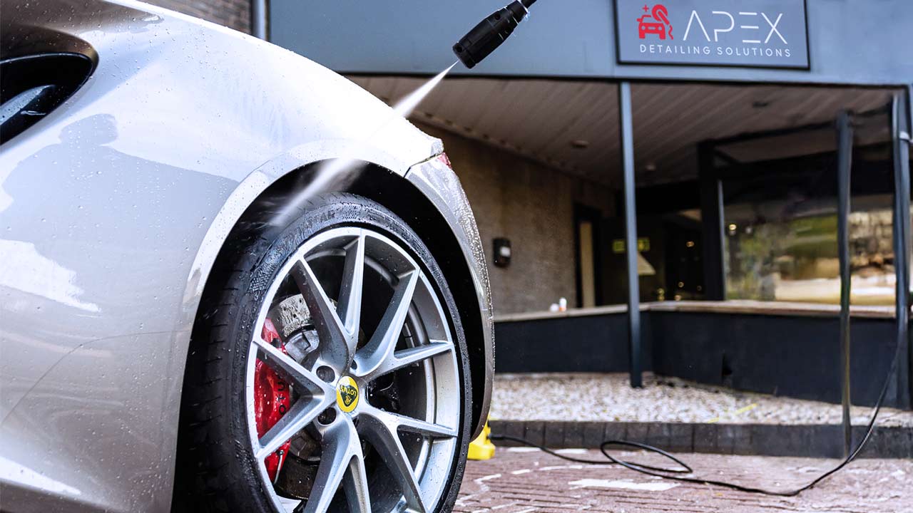 Apex Detailing Solutions - Exterior Detailing - spraying wheel of sports car