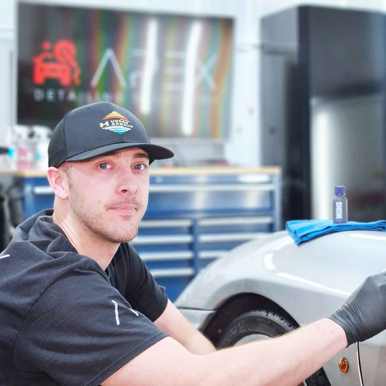 Apex Detailing Solutions - Exterior Detailing - spraying wheel of sports car