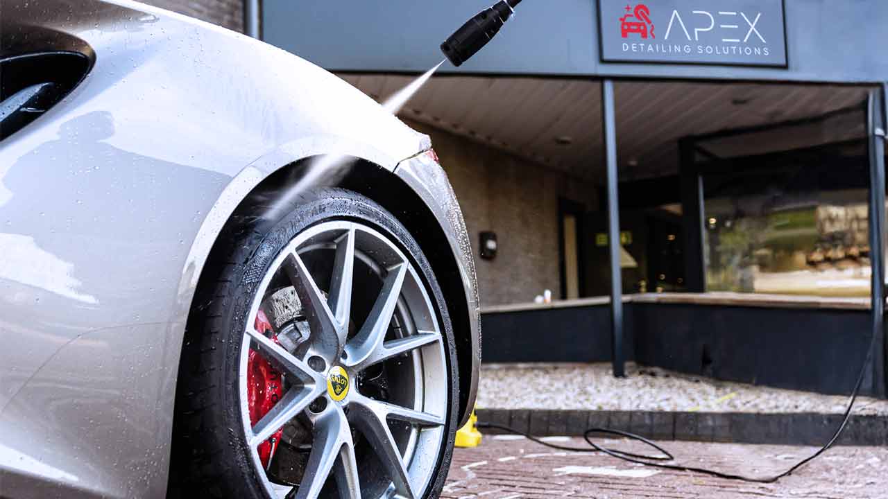 Apex Detailing Solutions - Exterior Detailing - spraying wheel of sports car